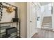 Functional mud room with storage racks and access to the stairway at 27756 E Byers Pl, Aurora, CO 80018