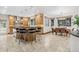 Spacious kitchen featuring a breakfast bar and eating nook with an expansive window at 2 Foxtail Cir, Cherry Hills Village, CO 80113