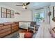 Bedroom featuring wood dresser and crib, patterned rug, and natural light at 5225 Balsam St # 1, Arvada, CO 80002