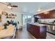 Modern eat-in kitchen featuring stainless steel appliances, granite countertops, and outdoor access at 5225 Balsam St # 1, Arvada, CO 80002