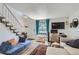 Inviting living room with modern furniture, wood floors, and staircase at 5225 Balsam St # 1, Arvada, CO 80002