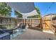 Relaxing patio with shade covering, stylish furniture, and fenced perimeter at 5225 Balsam St # 1, Arvada, CO 80002