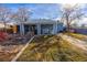 Expansive backyard featuring covered patio, laundry hookups, and garden space at 705 Kenton St, Aurora, CO 80010