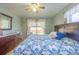 Inviting bedroom with hardwood floors, natural light, and peaceful backyard view at 705 Kenton St, Aurora, CO 80010