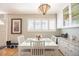 Bright dining area with modern lighting and a clean aesthetic at 705 Kenton St, Aurora, CO 80010