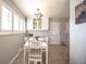 Cozy dining area featuring a modern light fixture and neutral color palette at 705 Kenton St, Aurora, CO 80010