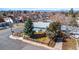 Charming single-story home featuring a well-manicured lawn and a lovely wooden fence, located on a corner lot at 705 Kenton St, Aurora, CO 80010