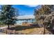Charming home with a well-manicured front yard, cozy deck, and inviting curb appeal at 705 Kenton St, Aurora, CO 80010