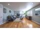 Bright living room with hardwood floors and large windows at 705 Kenton St, Aurora, CO 80010