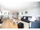 Open-concept living room with hardwood floors at 705 Kenton St, Aurora, CO 80010