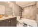Cozy bathroom includes tiled shower and tub combo and updated vanity at 108 W Byers Pl # G1, Denver, CO 80223