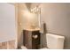Neutral bathroom features updated vanity and lighting fixture at 108 W Byers Pl # G1, Denver, CO 80223