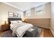 Staged bedroom is complete with two bright windows at 108 W Byers Pl # G1, Denver, CO 80223