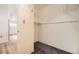 Carpeted closet complete with shelving at 108 W Byers Pl # G1, Denver, CO 80223