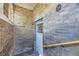 Private entrance featuring brick walls and tile flooring, providing a cozy and welcoming entryway at 108 W Byers Pl # G1, Denver, CO 80223