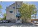 Attractive brick building with mature landscaping and welcoming entrance at The Lofts at Byers School at 108 W Byers Pl # G1, Denver, CO 80223