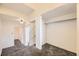 Bright hallway with carpeted floors, fresh white walls, and ample closet space at 108 W Byers Pl # G1, Denver, CO 80223