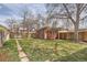 Spacious backyard with shed, wooden fence, and grassy area at 130 S Corona St, Denver, CO 80209