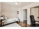 Cozy bedroom featuring hardwood floors, simple shelves, and comfortable workspace at 130 S Corona St, Denver, CO 80209