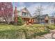 Street view of a red brick home with a well manicured lawn at 130 S Corona St, Denver, CO 80209
