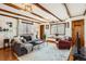 Cozy living room featuring wood beams, ample natural light, and comfortable seating at 130 S Corona St, Denver, CO 80209