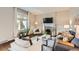 Inviting living room featuring hardwood floors, a fireplace, and natural light at 130 S Corona St, Denver, CO 80209