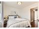 Charming main bedroom featuring hardwood floors, a cozy bed, and neutral decor at 130 S Corona St, Denver, CO 80209