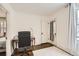 Home office featuring hardwood floors, desk, office chair, and natural lighting at 130 S Corona St, Denver, CO 80209