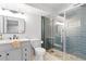 Modern bathroom featuring grey cabinets, a large shower with tile, and marble countertops at 18045 Arrowwood Dr, Monument, CO 80132