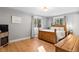 Serene bedroom with wood floors, bright windows, neutral colors, and cozy decor at 18045 Arrowwood Dr, Monument, CO 80132