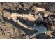 Bird's eye view of the house, showcasing its driveway and natural surroundings at 11683 Pointe View Dr, Longmont, CO 80503