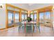 Bright breakfast nook surrounded by large sliding doors to the outside porch at 11683 Pointe View Dr, Longmont, CO 80503