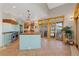 Open kitchen with large island, modern appliances, and access to covered porch at 11683 Pointe View Dr, Longmont, CO 80503