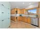 Bright kitchen features custom wood cabinetry and stainless steel appliances at 11683 Pointe View Dr, Longmont, CO 80503