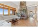 Comfortable living room featuring a stone fireplace and gorgeous views at 11683 Pointe View Dr, Longmont, CO 80503
