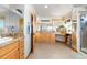 Primary bathroom features double vanity, walk-in shower, and exterior view at 11683 Pointe View Dr, Longmont, CO 80503