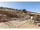 Outdoor patio with swing set and seating area with sweeping views of the hillside at 11683 Pointe View Dr, Longmont, CO 80503