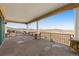 Expansive covered patio with stone columns offering breathtaking views of the surrounding landscape at 11683 Pointe View Dr, Longmont, CO 80503