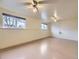 Large basement with linoleum flooring, and dual ceiling fans and windows for natural light at 2893 S Joslin Ct, Denver, CO 80227