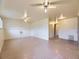 Large basement with drop ceiling, ceiling fans, and bonus space at 2893 S Joslin Ct, Denver, CO 80227