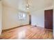 Well-lit bedroom with hardwood floors, a ceiling fan, and a window facing the yard at 2893 S Joslin Ct, Denver, CO 80227