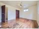 Spacious bedroom with hardwood flooring, a ceiling fan, and ample closet space at 2893 S Joslin Ct, Denver, CO 80227