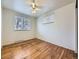 Bedroom with hardwood floors, two windows, and a ceiling fan with natural light at 2893 S Joslin Ct, Denver, CO 80227