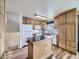 Well-lit kitchen with a kitchen island and ample counter space, ideal for cooking at 2893 S Joslin Ct, Denver, CO 80227