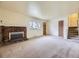 Another view of living room features brick fireplace and a welcoming atmosphere at 2893 S Joslin Ct, Denver, CO 80227