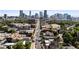 Urban view featuring a street, buildings, and the downtown Denver skyline in the background at 1519 E 29Th Ave, Denver, CO 80205