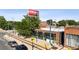 Commercial building with a vibrant mural and street view, surrounded by urban activity and trees at 1519 E 29Th Ave, Denver, CO 80205