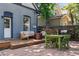Backyard featuring a wooden deck, comfortable seating, a grill, and a charming green dining set at 1519 E 29Th Ave, Denver, CO 80205