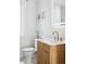 Well-lit bathroom with modern vanity, stylish faucet, and clean white toilet at 1519 E 29Th Ave, Denver, CO 80205