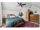 Bright bedroom with a ceiling fan, white walls, and natural light from the window at 1519 E 29Th Ave, Denver, CO 80205